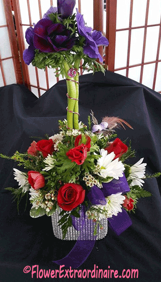 basket of white daisies and red roses + purple flowers and bow